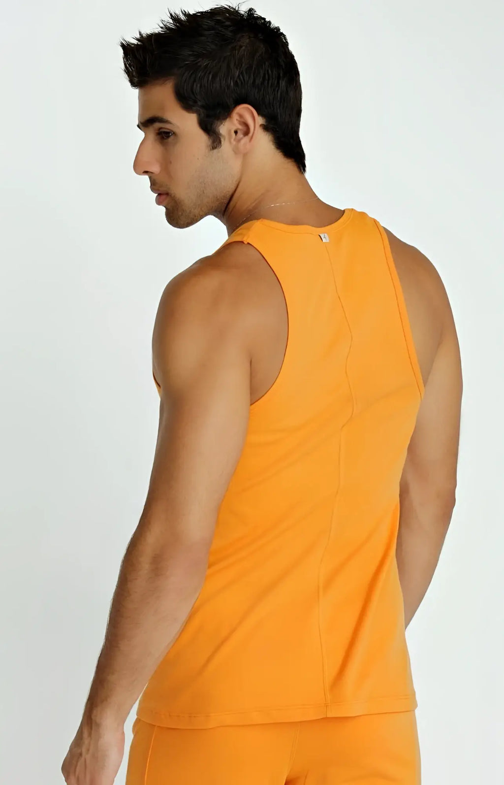 Orange sleeveless athletic tank top sustain tank made from sustainable fabric ideal for active wear