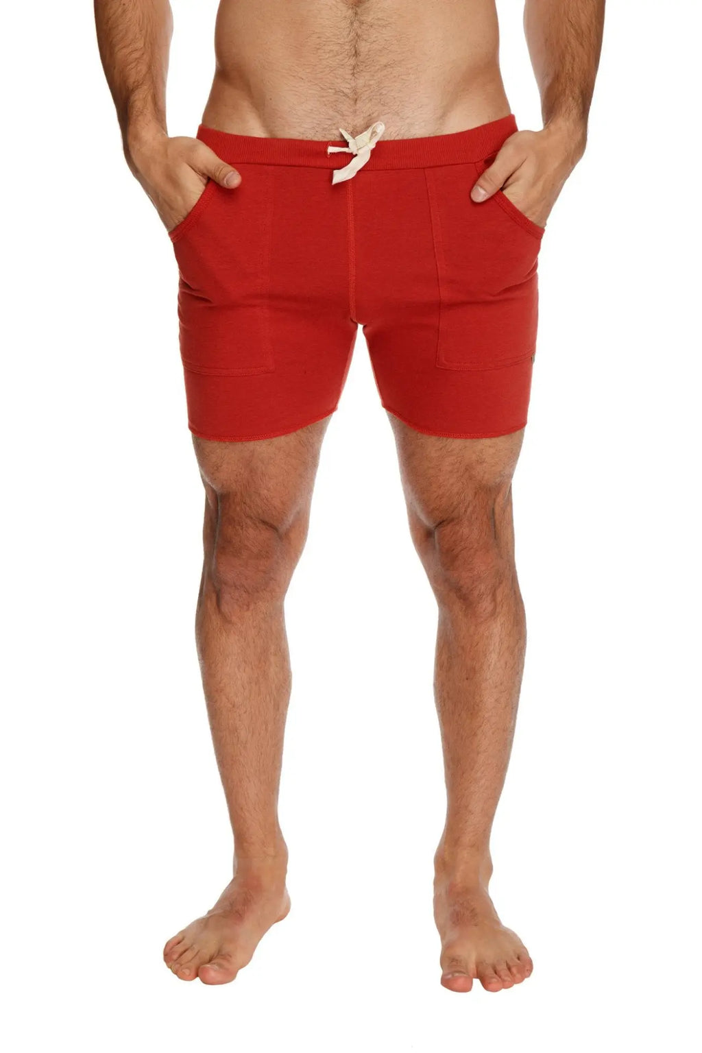 Transition yoga short in cinnabar red featuring a drawstring waistband and side pockets for athletic use