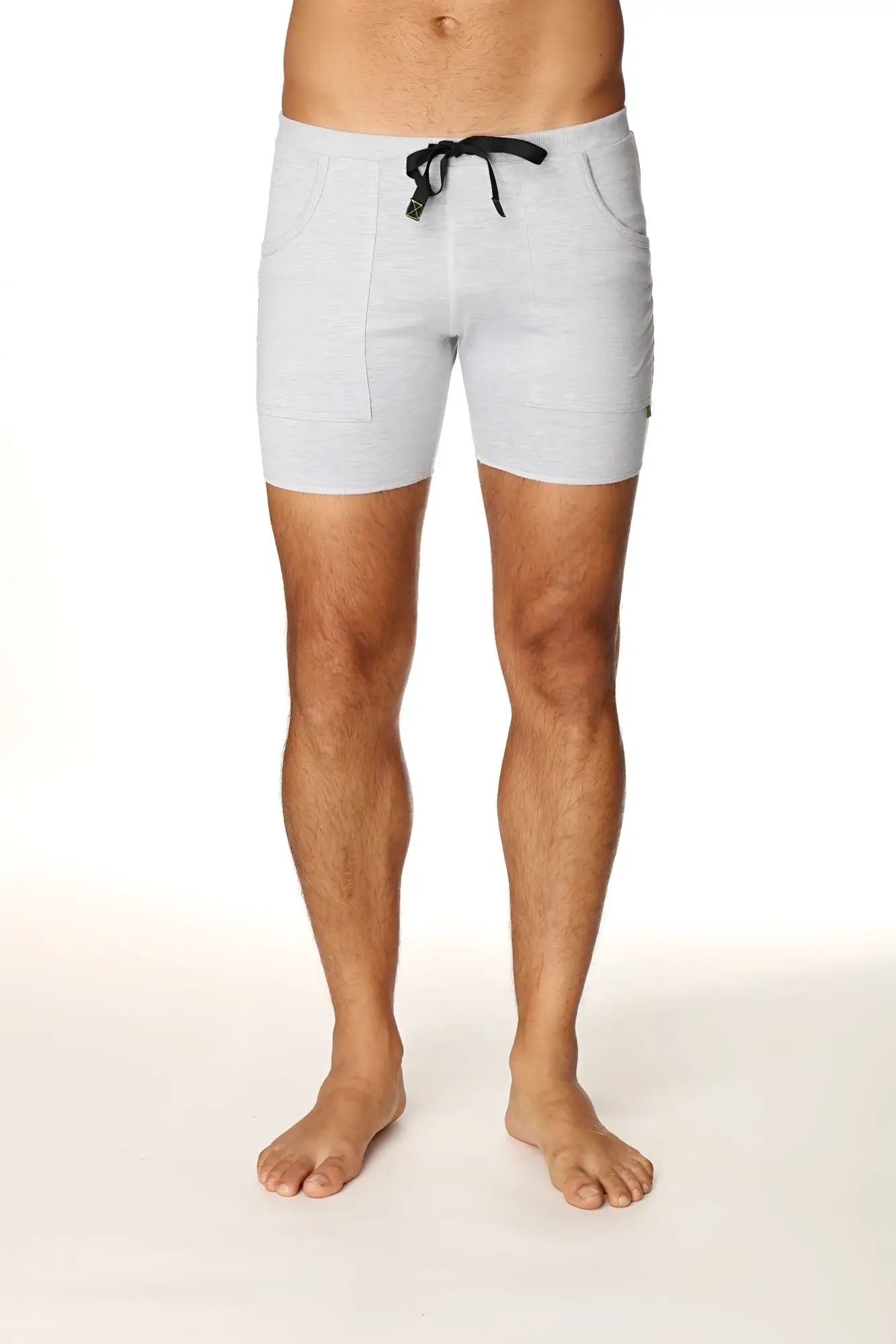 Light gray heathered transition yoga shorts with black drawstring and side pockets designed for comfort and flexibility