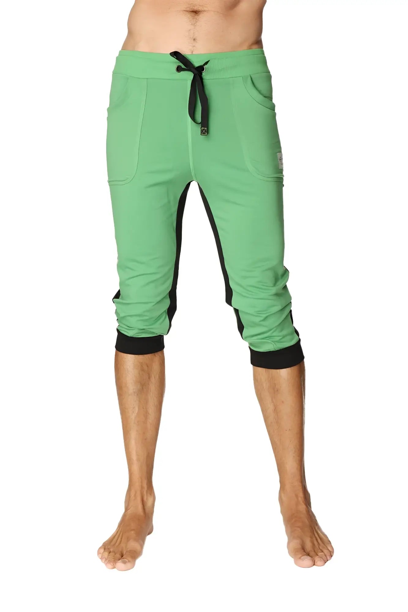 Green ultra-flex tri-color cuffed yoga pant with black side panels elastic cuffs and capri-length joggers style