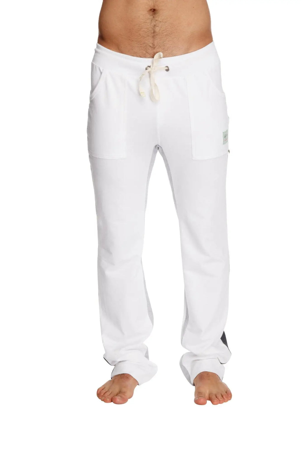 White ultra flex yoga sweatpant with drawstring, side pockets, small brand tag on thigh for flexible workouts