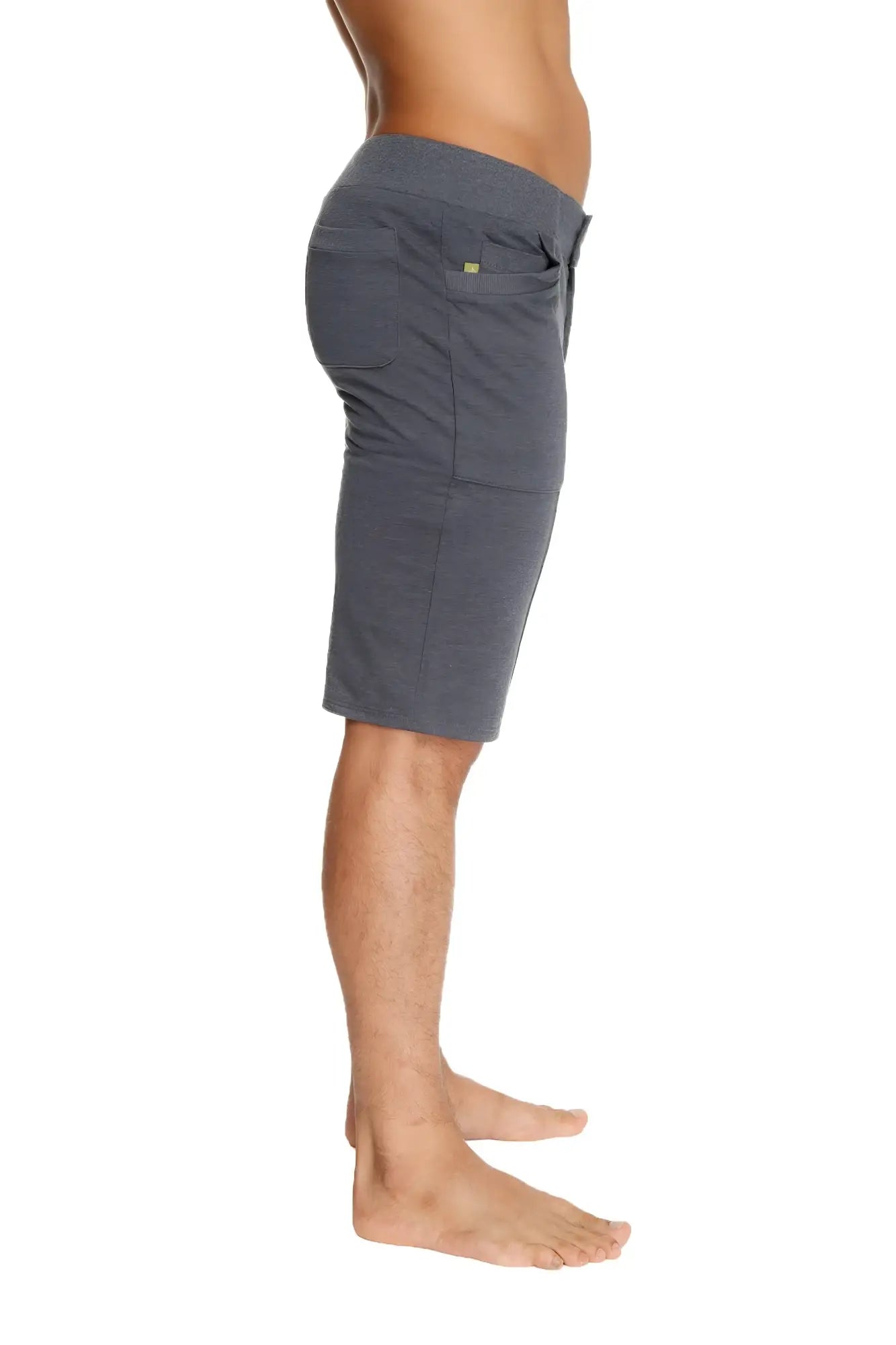 Urban tactical charcoal gray heathered shorts with drawstring waist, side pockets, and small green logo on right pocket