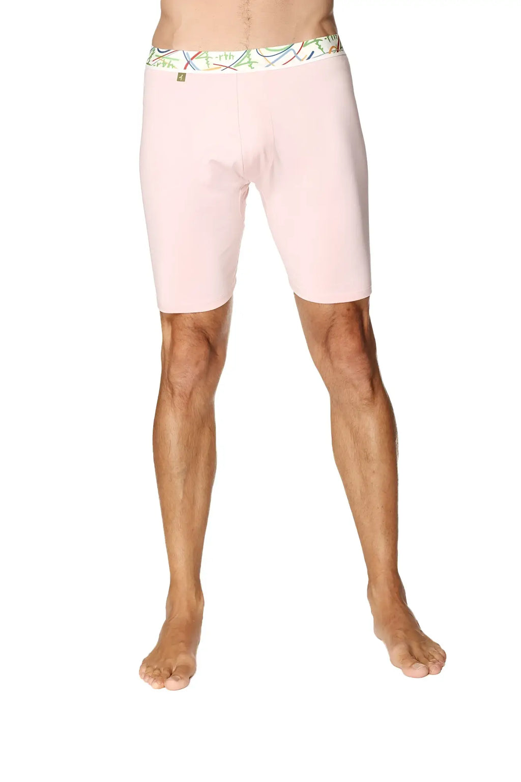 Pink men’s yoga compression shorts with a colorful patterned waistband designed for support and flexibility