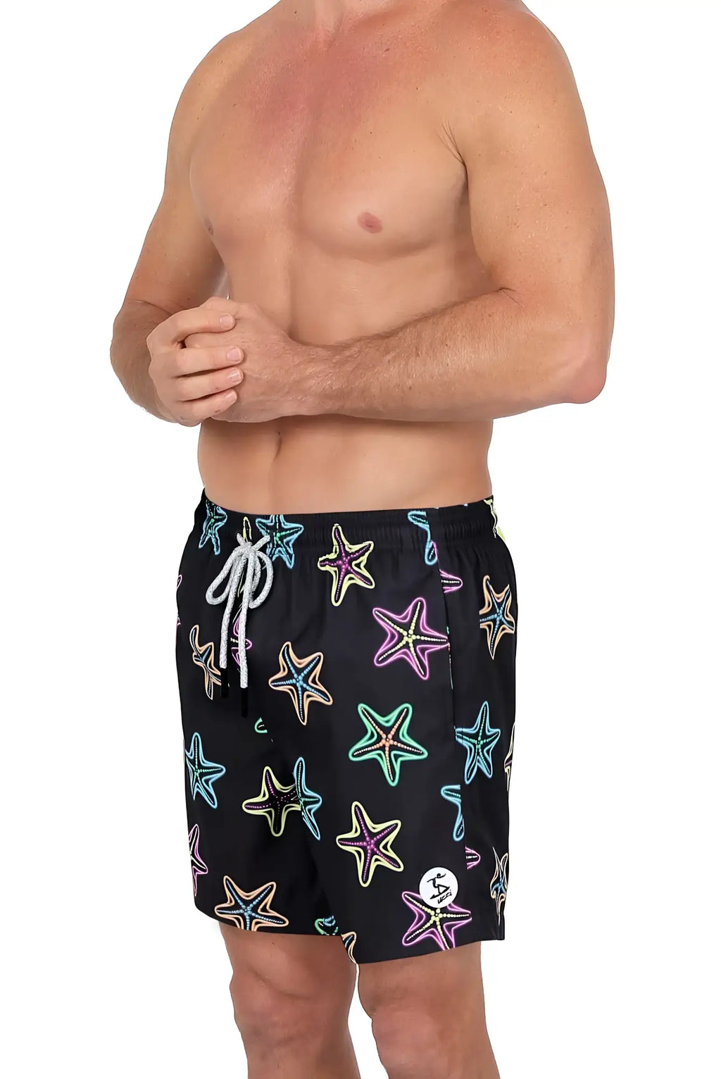 Black 4 way stretch swim shorts featuring a vibrant multicolored starfish pattern with neon outlines and white drawstrings