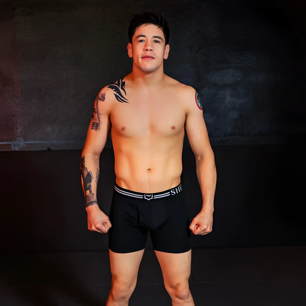 Black dual pouch boxer briefs with white striped waistband featuring she logo from sheathed 4.0 best-seller bundle