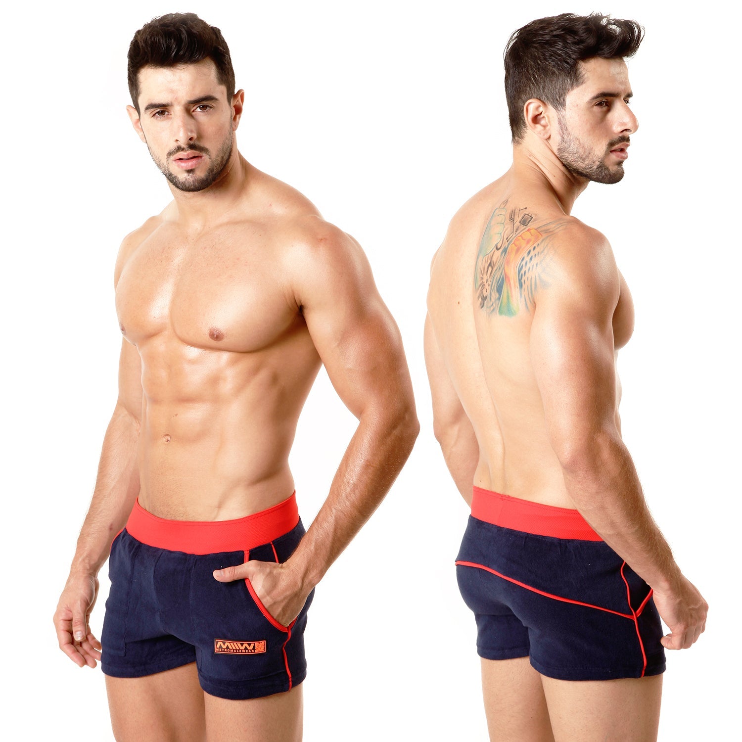 Navy blue terry sport shorts with red elastic waistband and trim featuring small orange logo on lower left leg by metromalewear