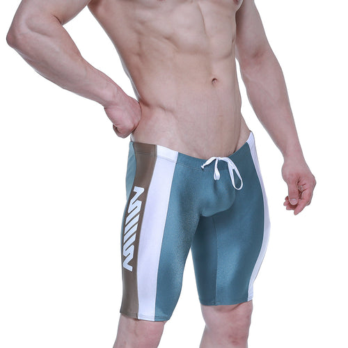 Teal and white athletic swim trunks with brown side stripe and zen branding on the leg from metamalewear jammer series