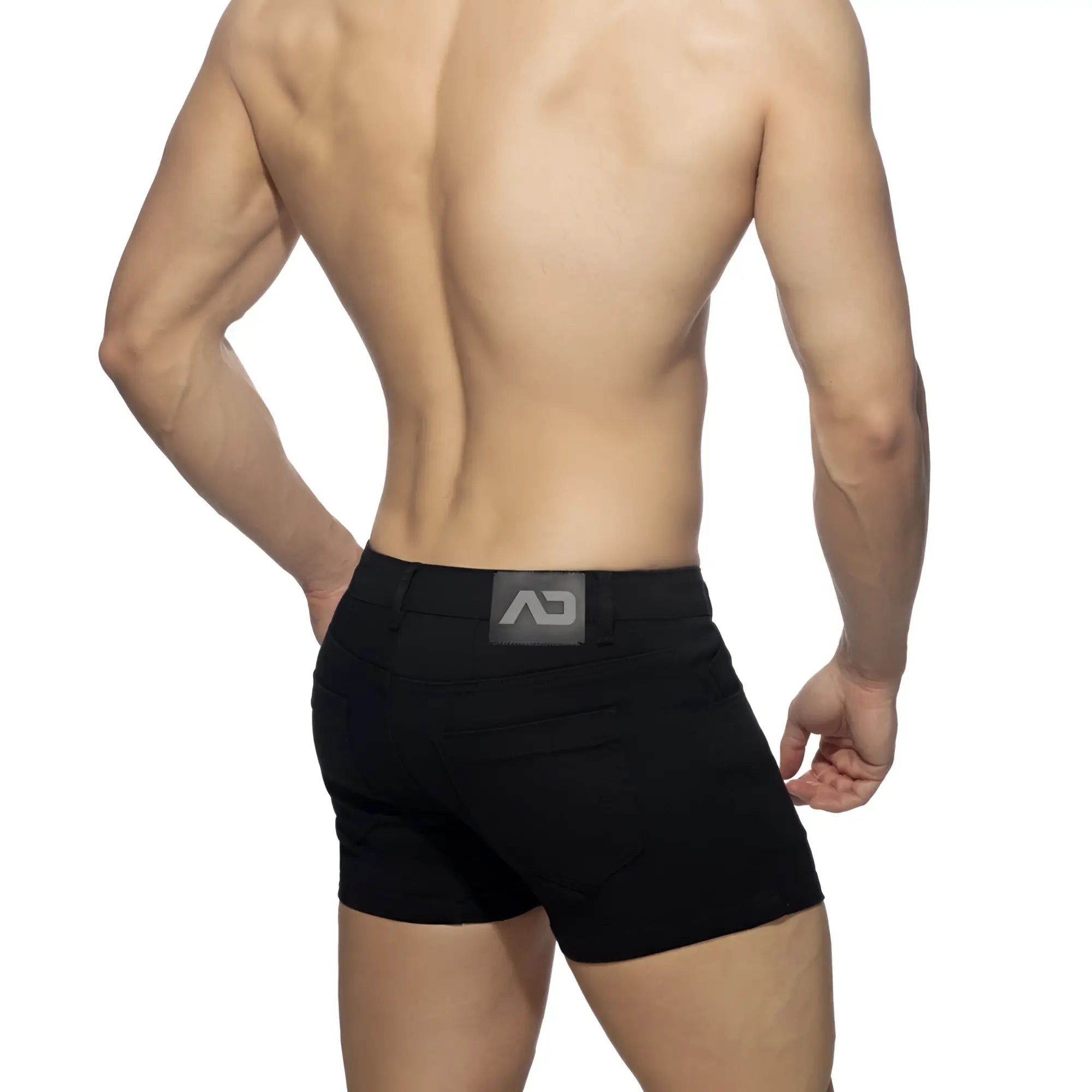 Black athletic 5 pockets summer shorts with sleek form-fitting design and subtle gray logo patch at the waistband