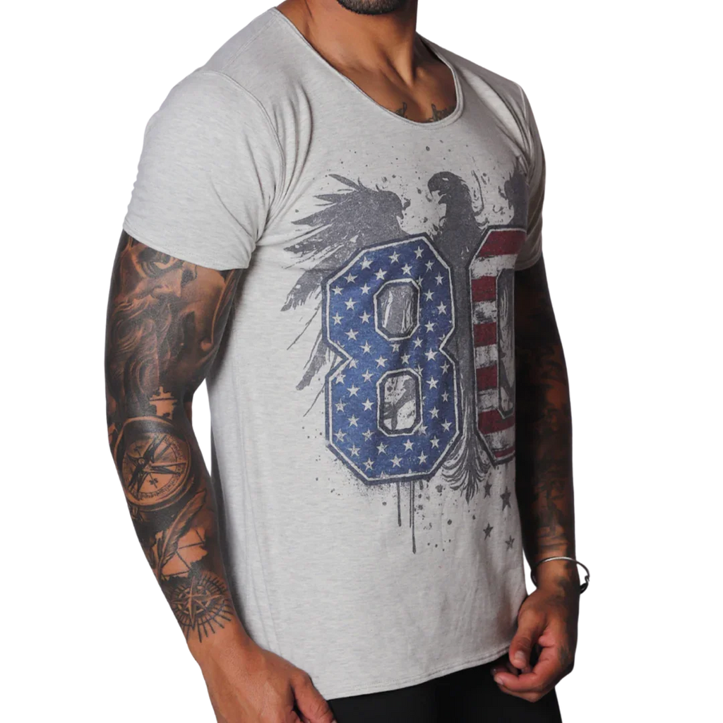 Light grey, raw-edge scoop neck t-shirt featuring a distressed eagle graphic with US flag-patterned "80" text.