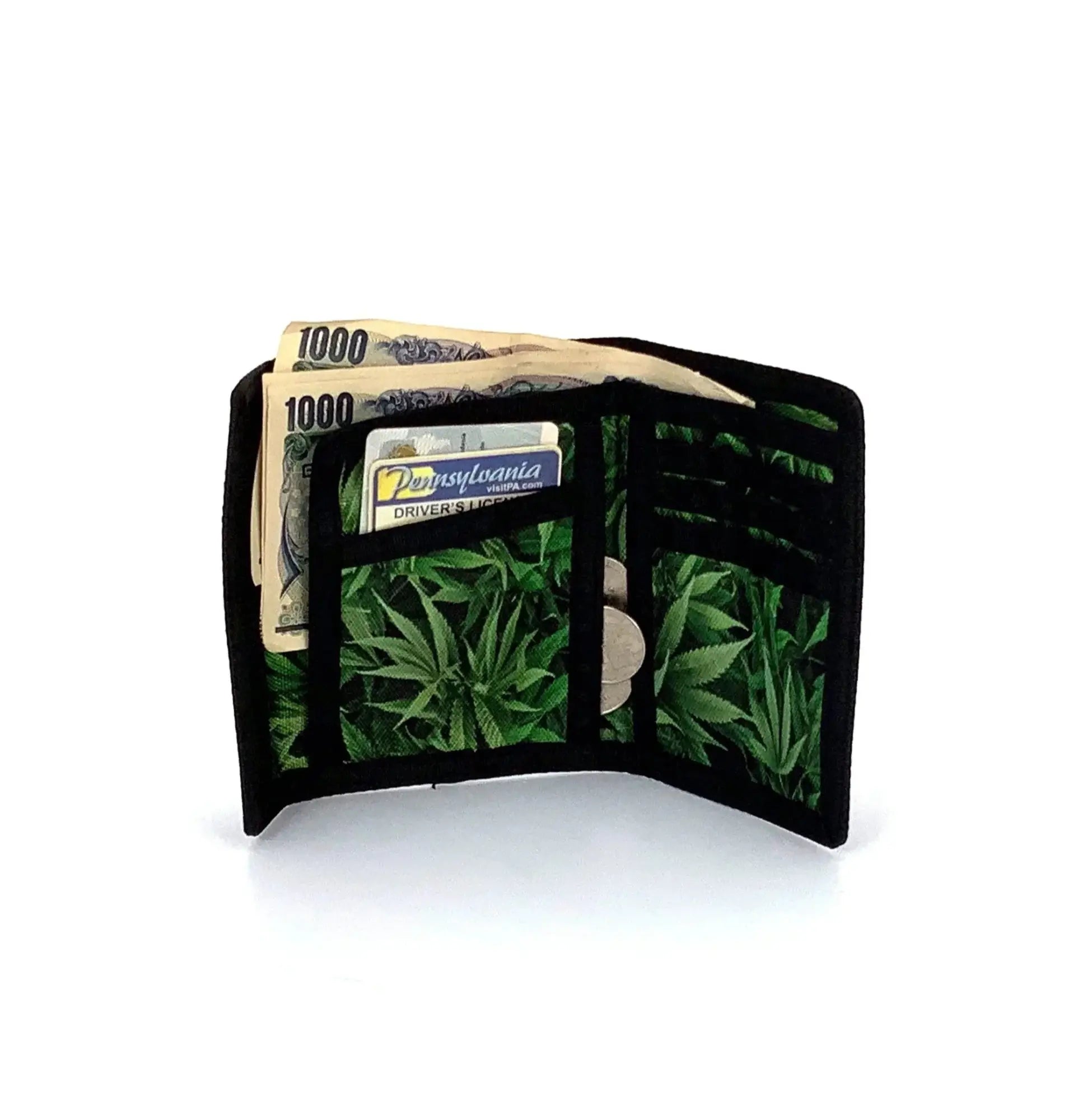 Black 80s veclro wallet with tri-fold design and green cannabis leaf pattern on the interior lining