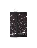Black tri-fold 80s velcro wallet with white paint splatter pattern and silver metal ring at the top