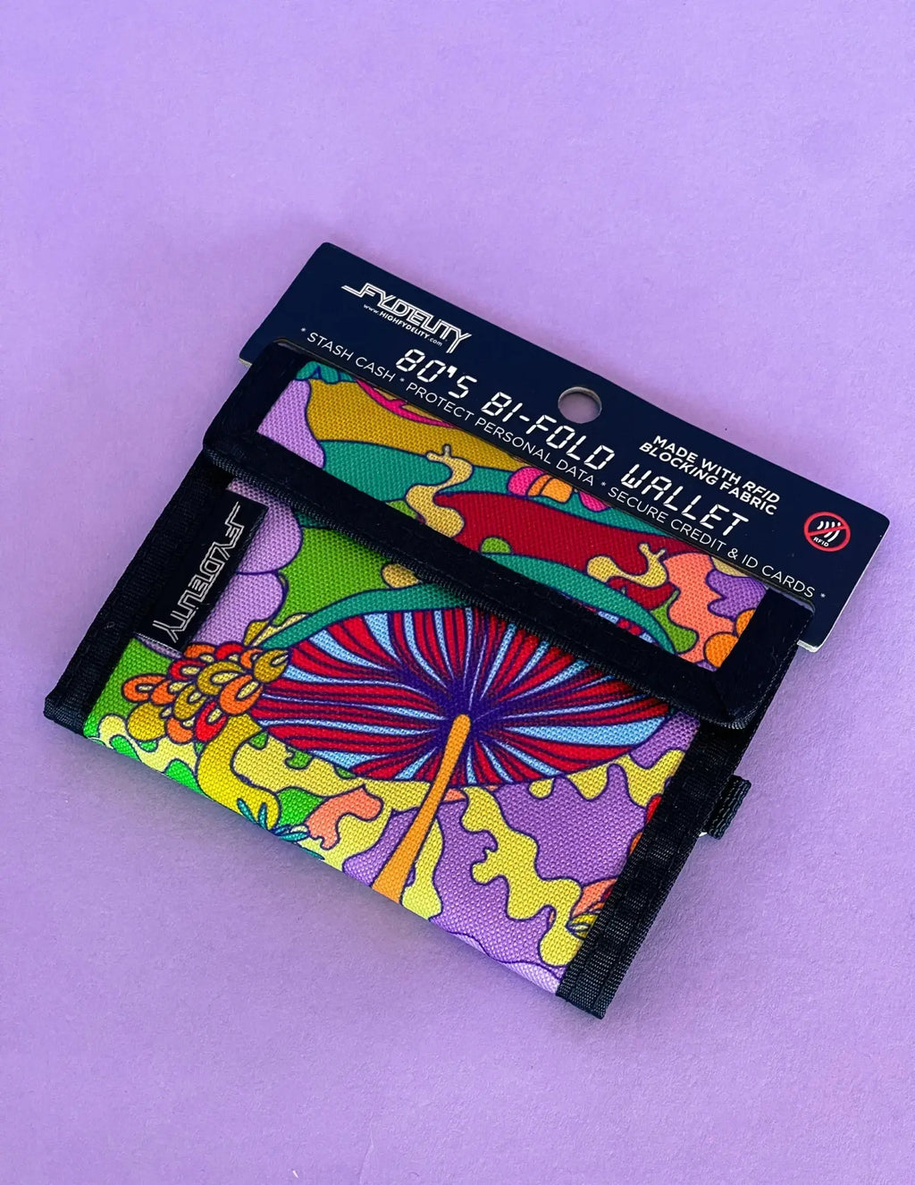A vibrant 80s bi-fold wallet with psychedelic mushroom and floral fabric design featuring velcro closure