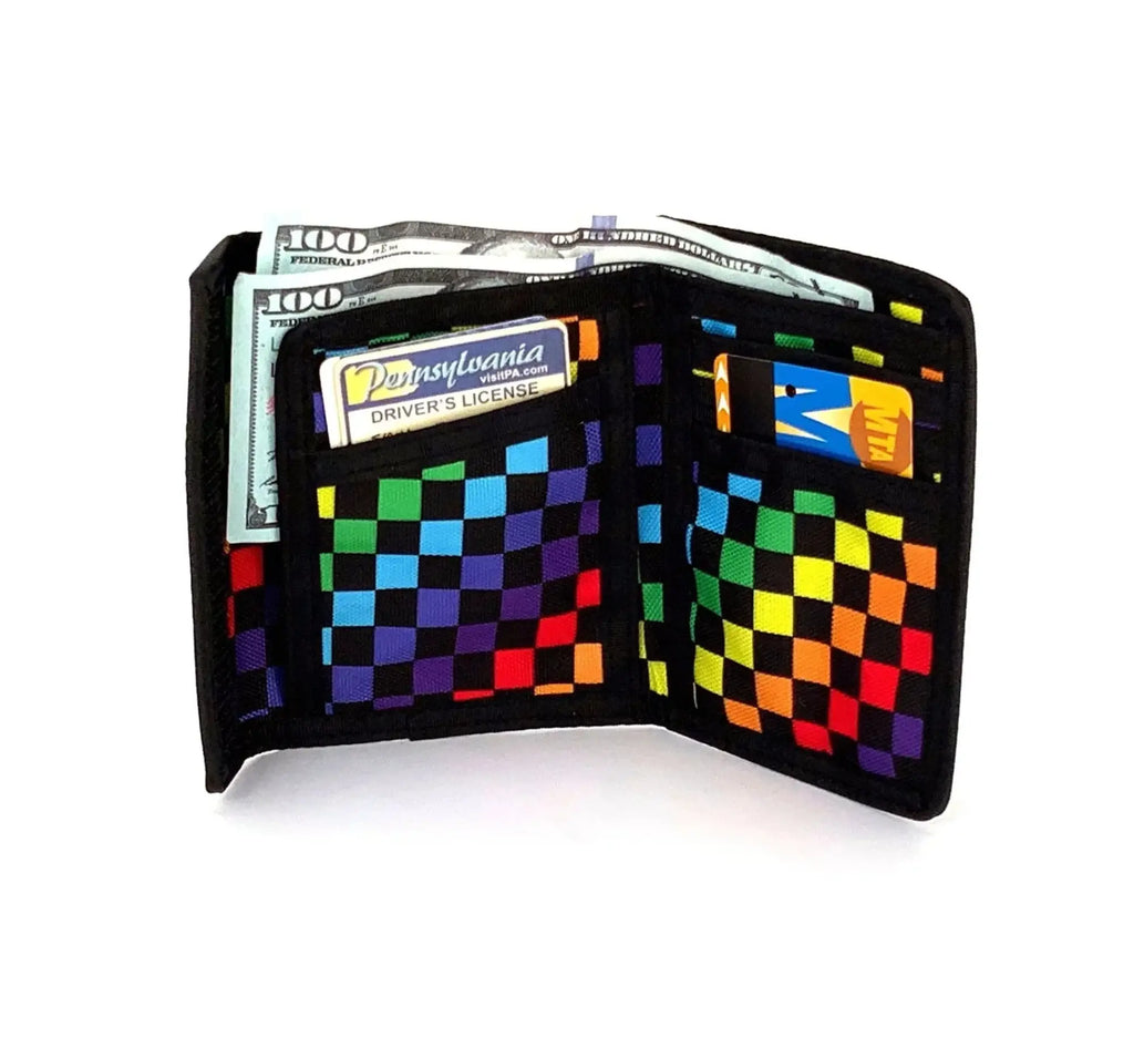 A vibrant rainbow checkered 80s velcro wallet with black edges and multiple card slots in a trifold design