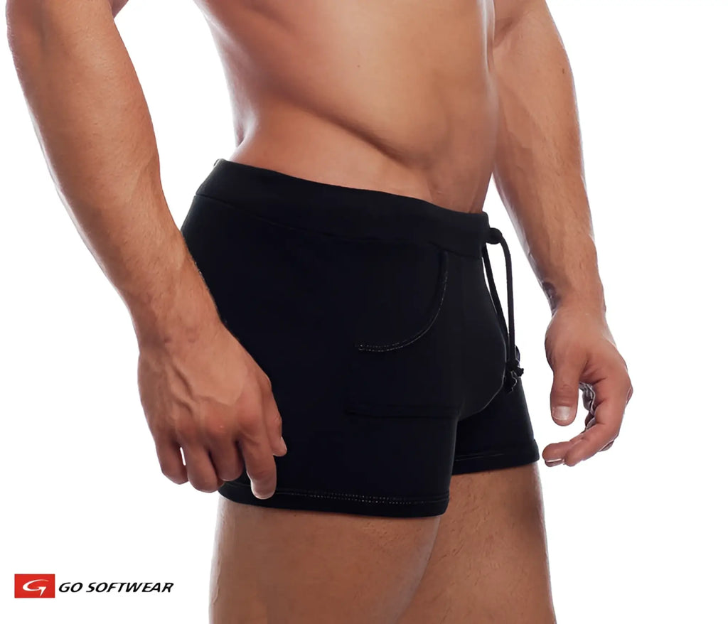 Black 9 inch sport short with pockets featuring a drawstring waistband and subtle stitching details