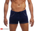 Navy blue 9 inch sport swim trunks with contrasting silver stitching and drawstring waistband with pockets