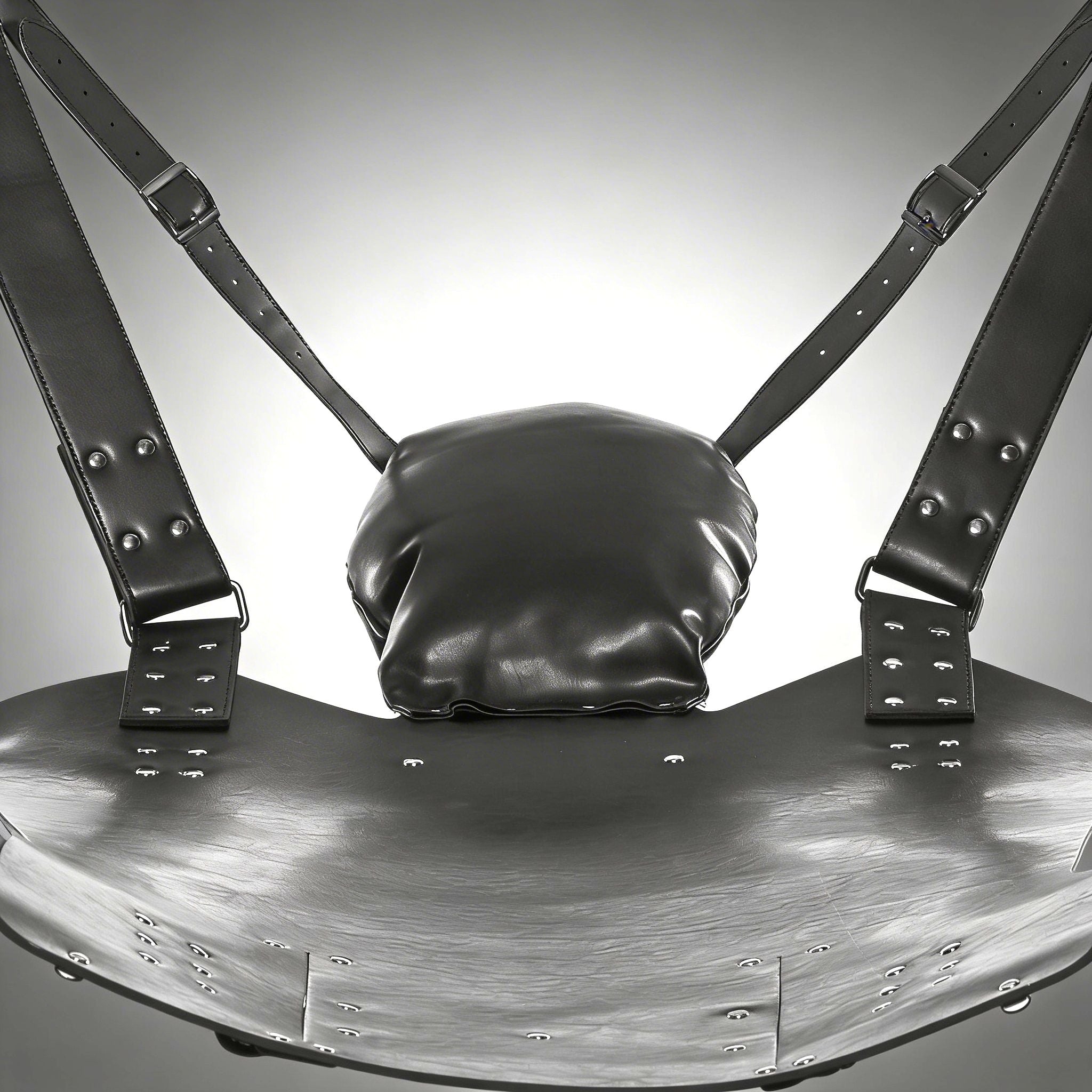 Strict Leather Lined Sling with black leather seat, adjustable buckled straps, rivets, and a cushioned headrest pillow.