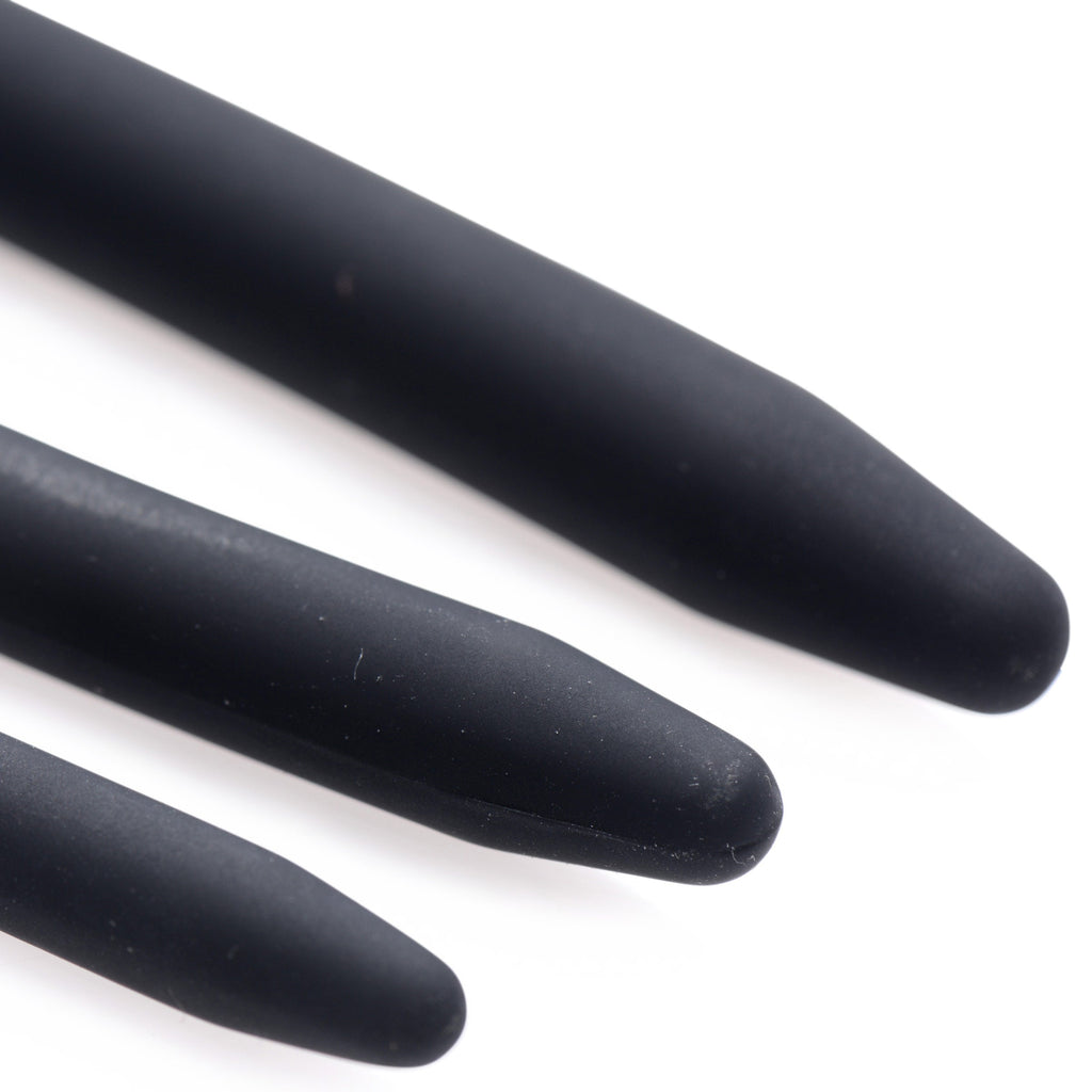 Close-up of three matte black Master Series Bolted Deluxe silicone urethral sounds with tapered, rounded tips.