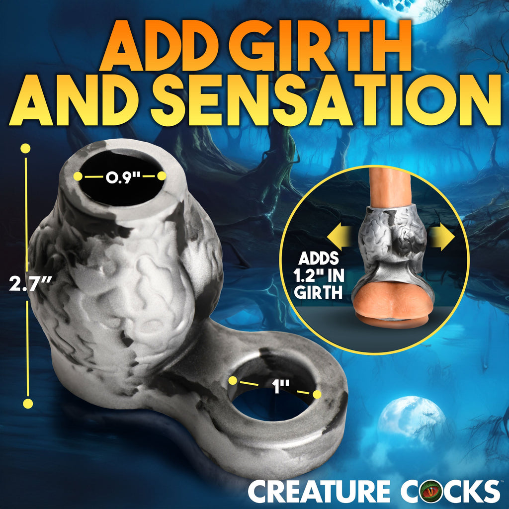 Creature Cocks Night Prowler: A black and white marbled silicone girth enhancer and ball strap with measurement labels.