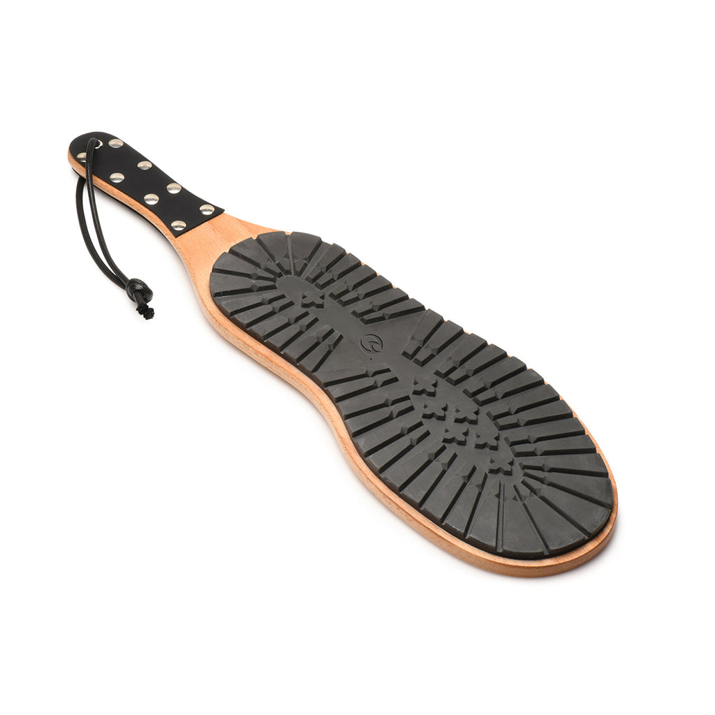 Master Series Tread Boot Paddle with a light wood handle, black studded leather grip, and a textured rubber tread face.