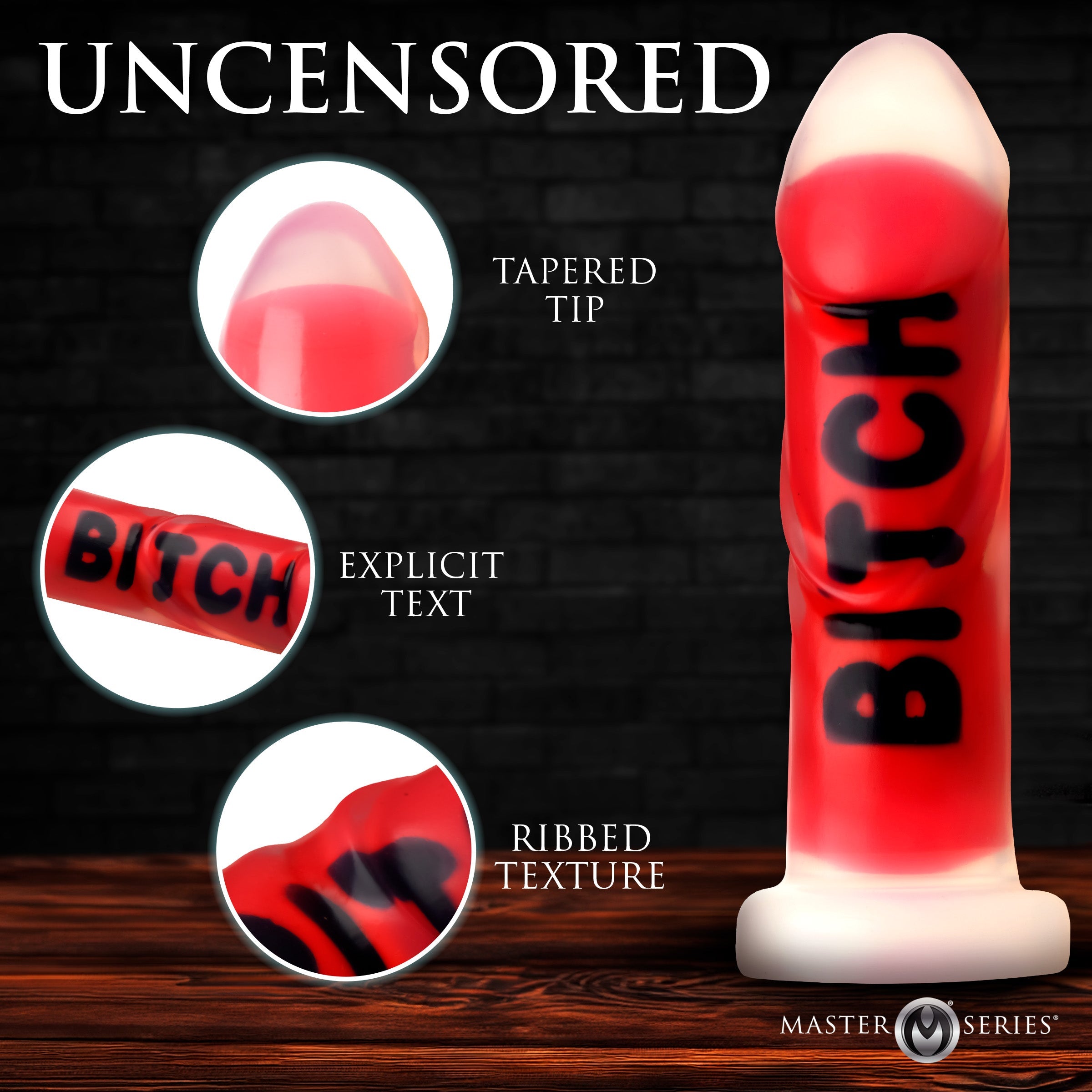 Master Series Explicit Text dildo: a red silicone toy with a tapered tip, ribbed texture, and black text detail.