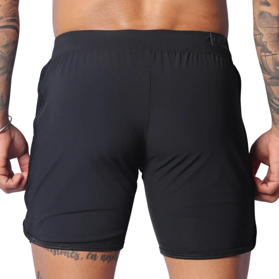 Rear view of black Gigo Ambitious athletic shorts featuring a flat waistband and minimalist, seamless design.