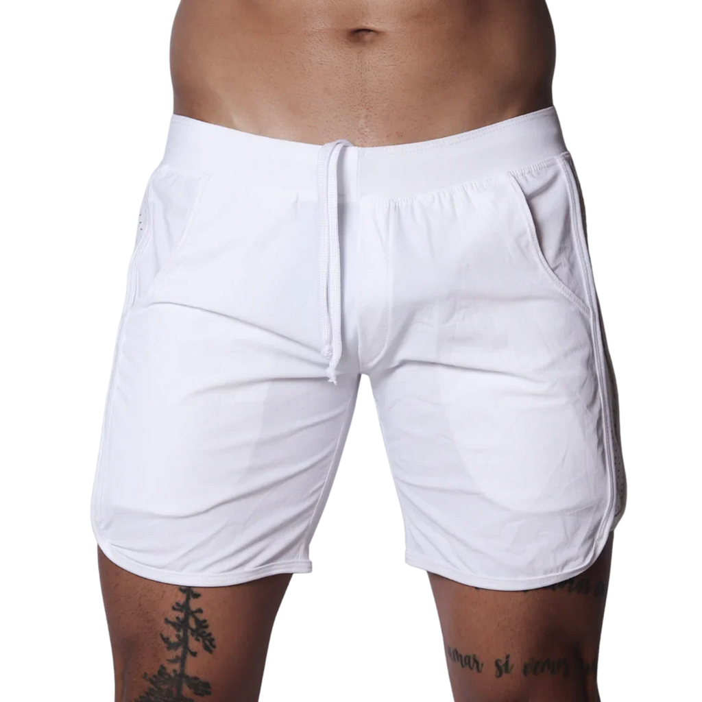 White athletic shorts featuring an elastic waistband with drawstring, side pockets, and curved hem detail.