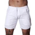 White athletic shorts featuring an elastic waistband with drawstring, side pockets, and curved hem detail.
