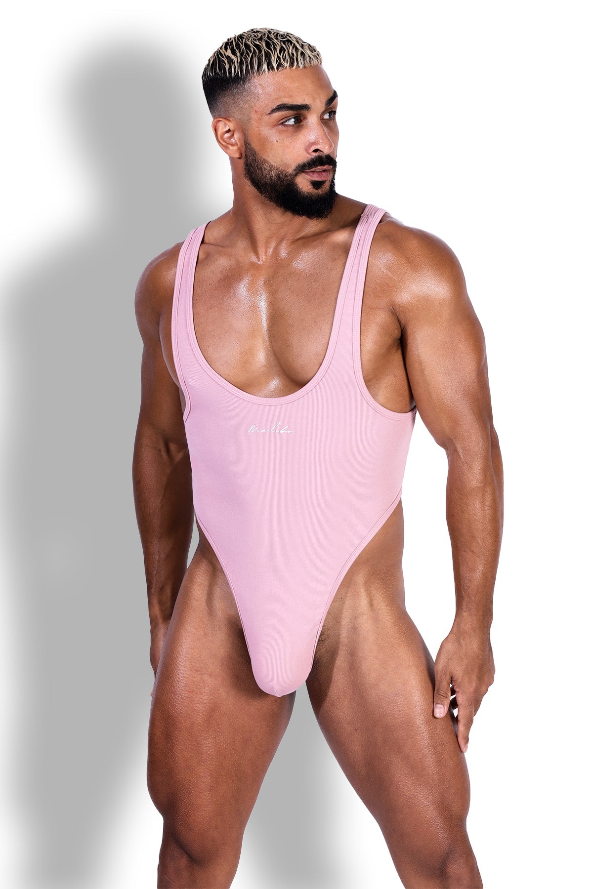 Afterglow ribbed bodysuit blush pink sleek form-fitting one-piece swimsuit with deep scoop neckline and high-cut legs