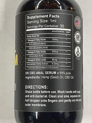 Dark amber glass bottle of dr cbd anal serum with black label white text and american flag emblem containing 95 hemp seed oil