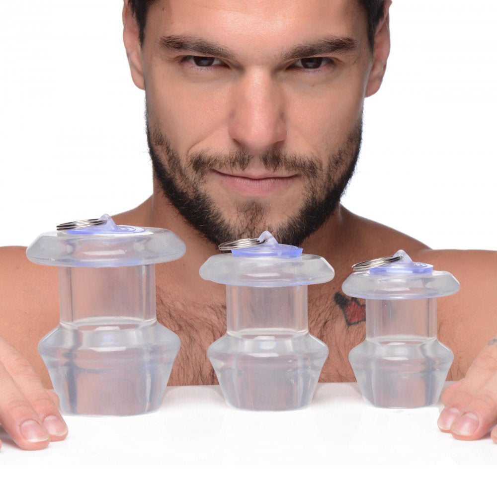 Dilatador anal hueco transparente con tapón para el culo
