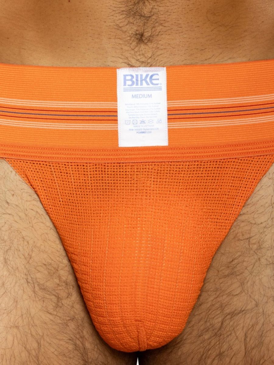 Orange BIKE athletic jockstrap with a textured pouch and striped waistband.