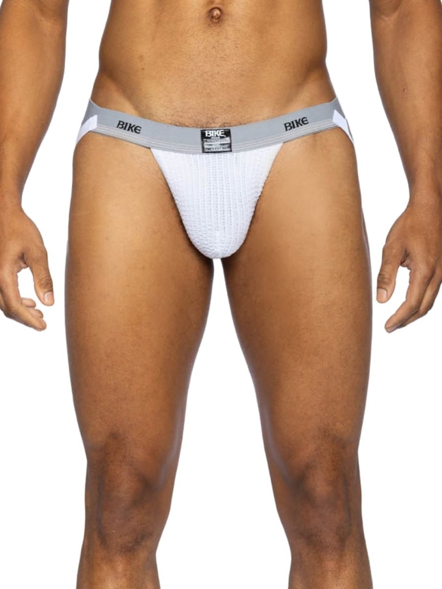 White BIKE athletic jockstrap with grey waistband, worn by a man.