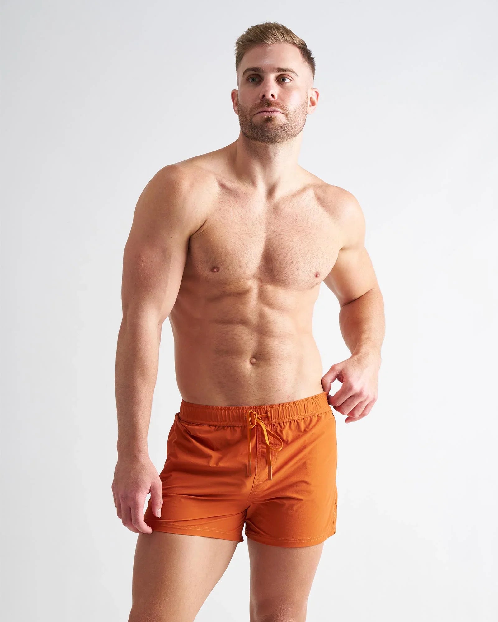 Orange athletic swim trunks bolt 3 short with drawstring waistband designed for active water use