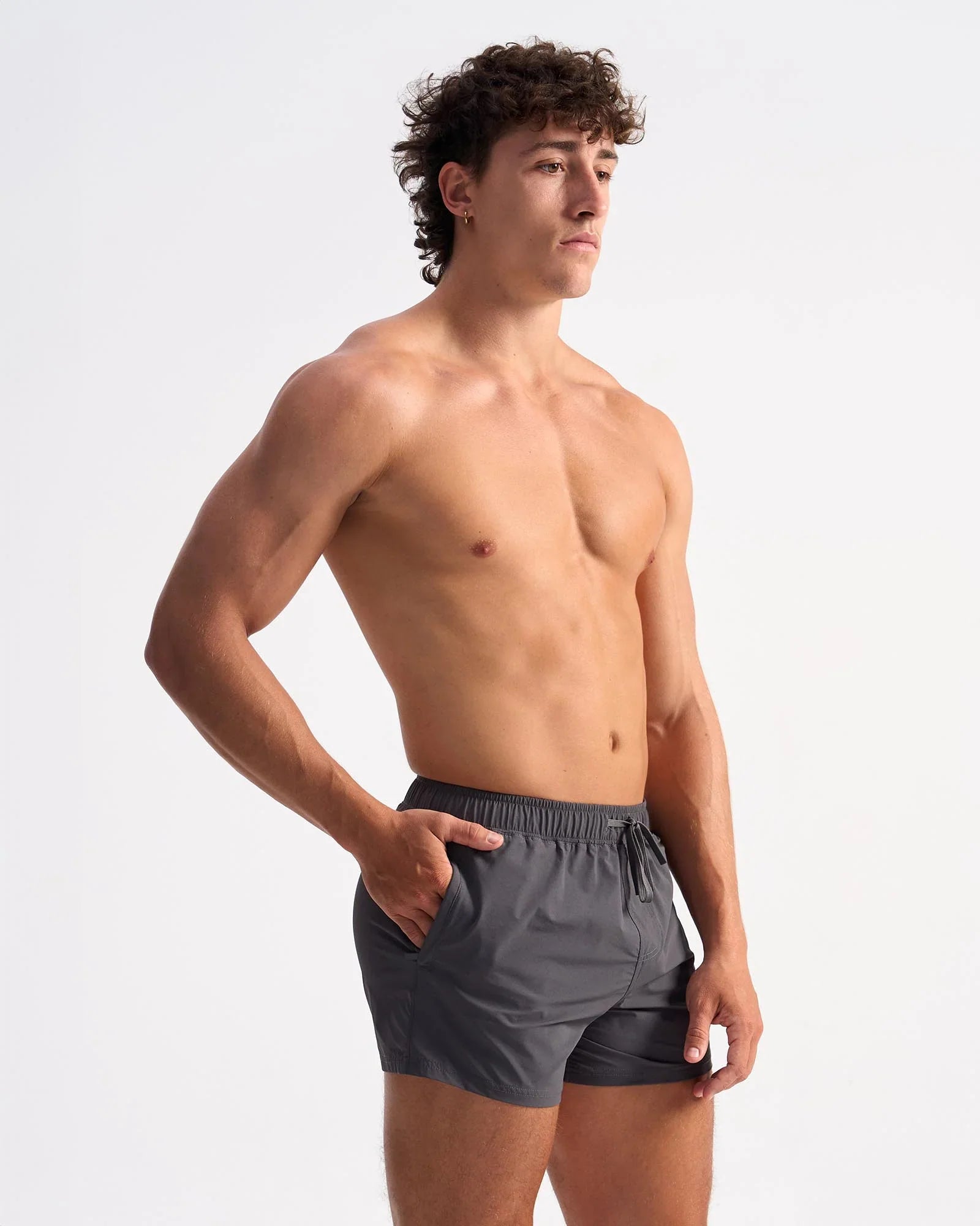 Dark gray lightweight bolt 3 inch swim trunks with elastic waistband and drawstring for comfortable wear