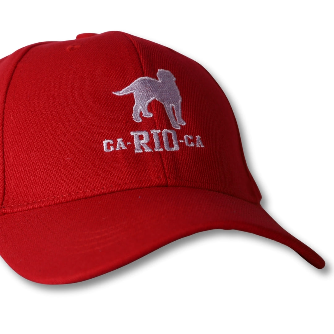 Red baseball hat with gray embroidered dog silhouette and white ca-rio-ca text on front for casual wear