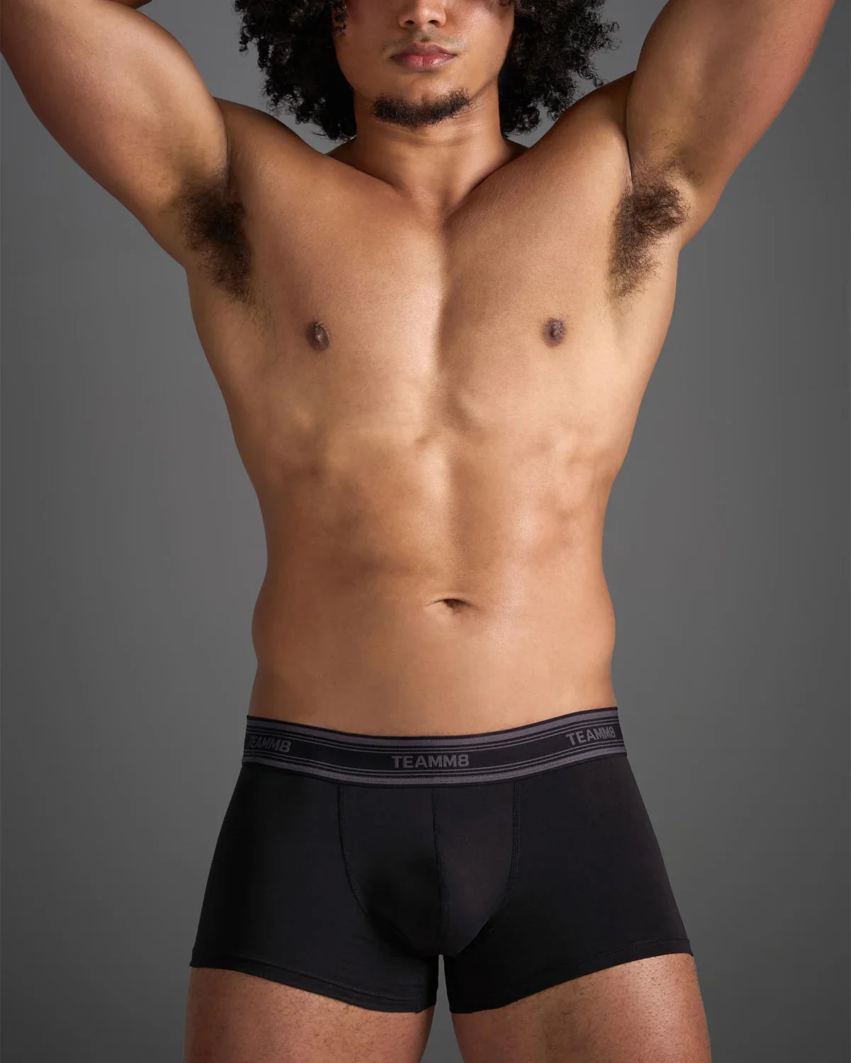 Black classic cotton trunk boxer briefs with gray elastic waistband and white brand lettering