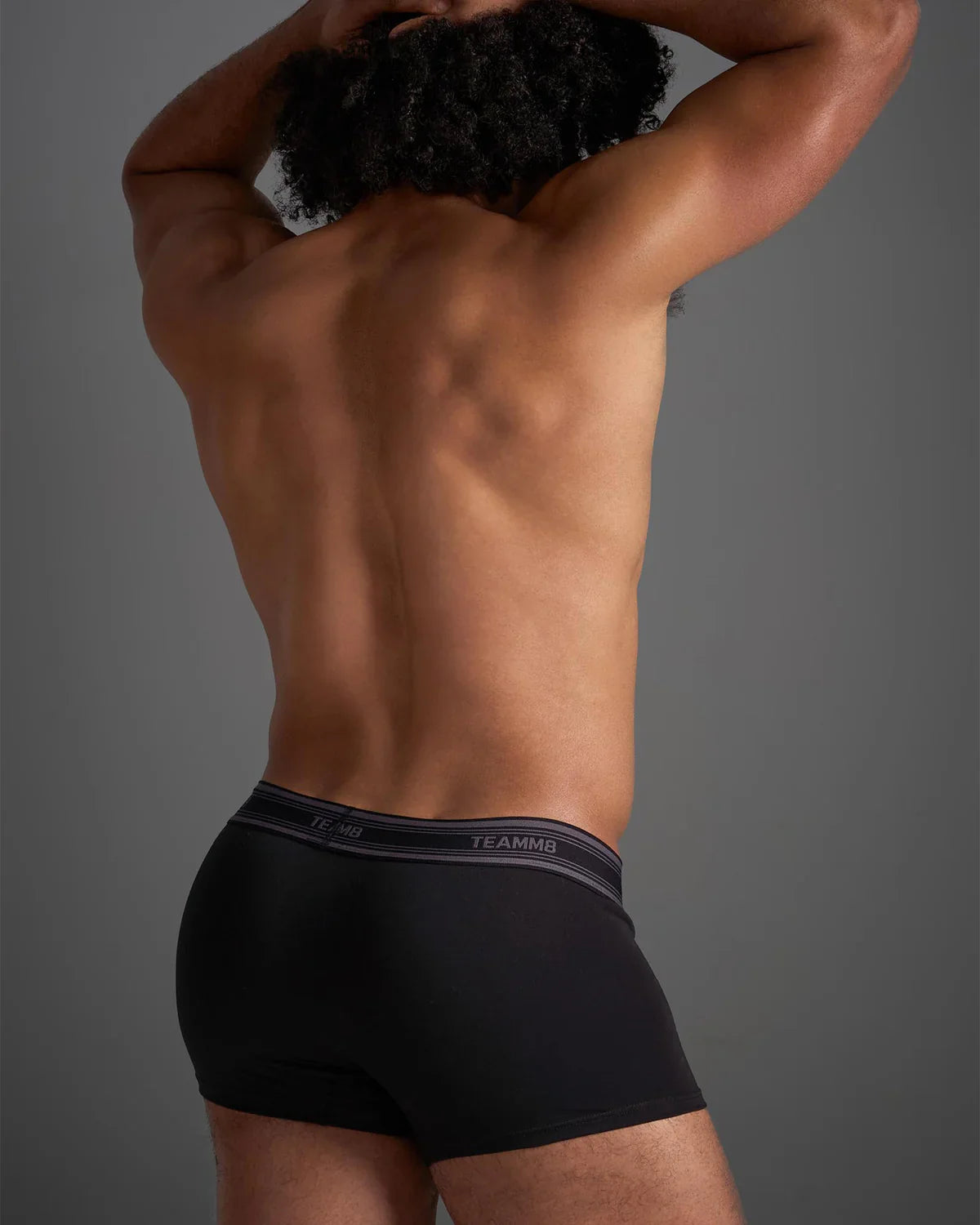 Black classic cotton trunk boxer briefs with gray elastic waistband featuring white brand name lettering