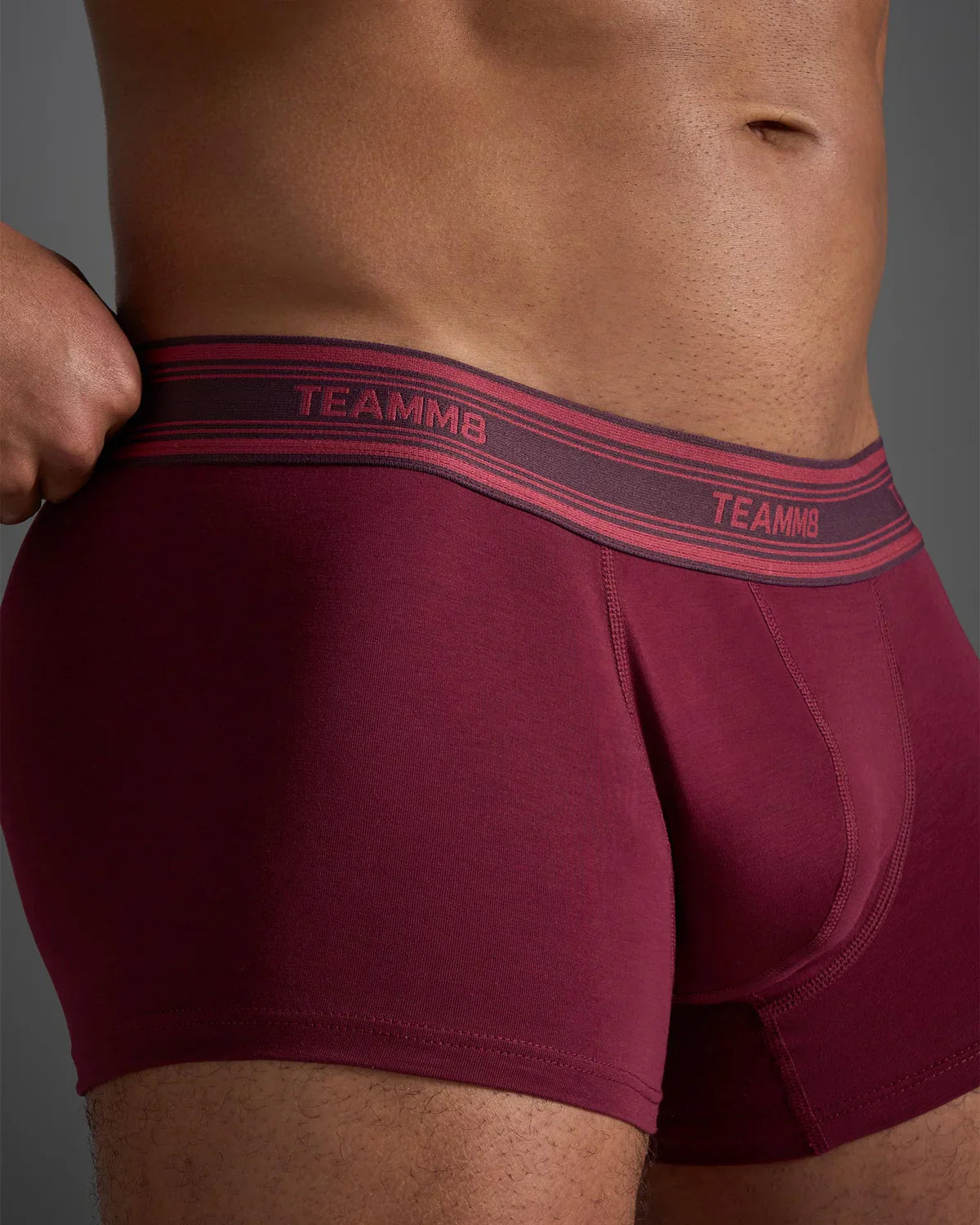 Classic cotton trunk maroon boxer briefs with contrasting pink and dark gray elastic waistband featuring brand name