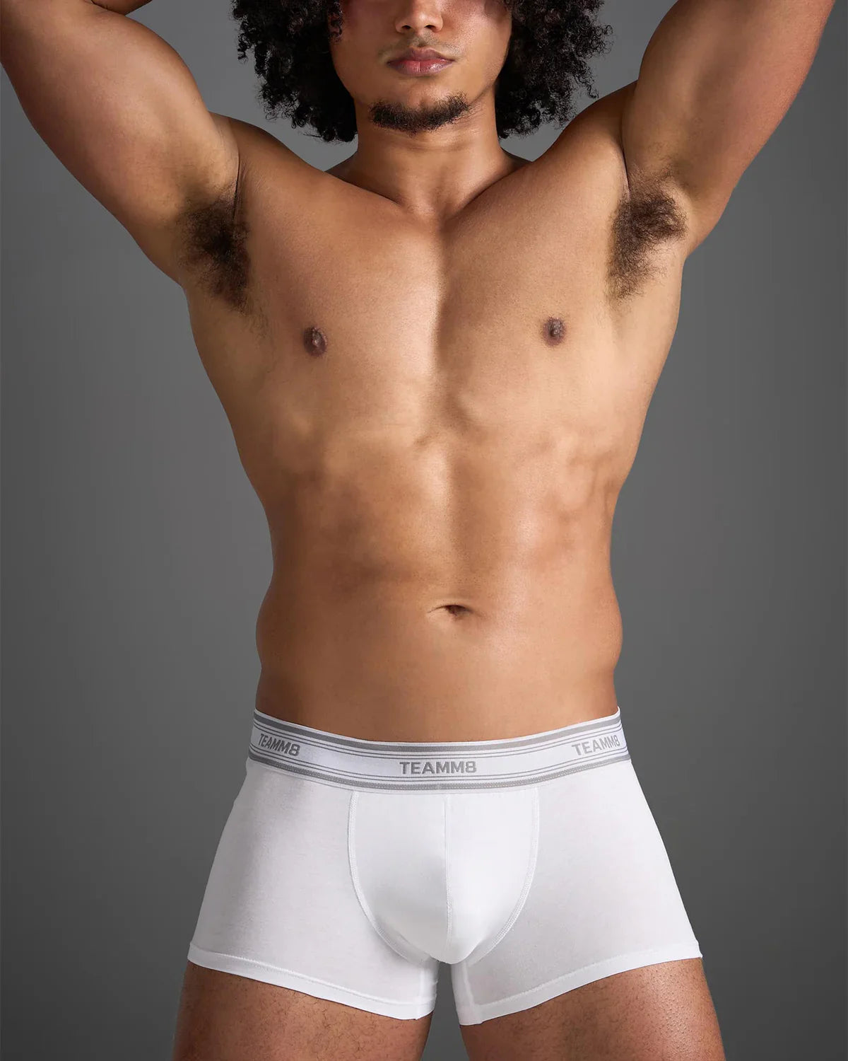 White classic cotton trunk boxer briefs with gray elastic waistband featuring black brand lettering