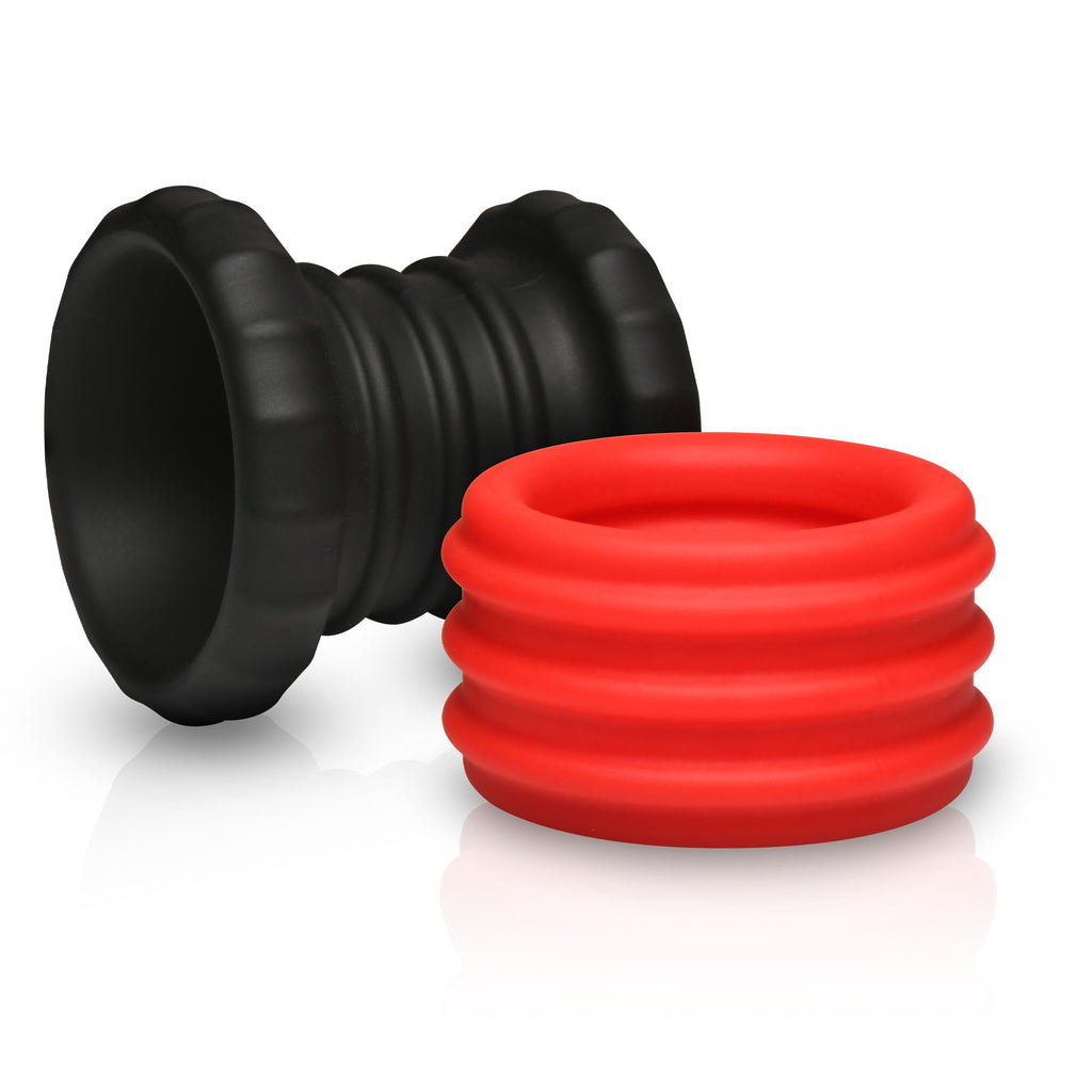 Curve Toys Enhancers 2-in-1: a black ribbed sleeve and a red ribbed silicone cock ring on a white background.