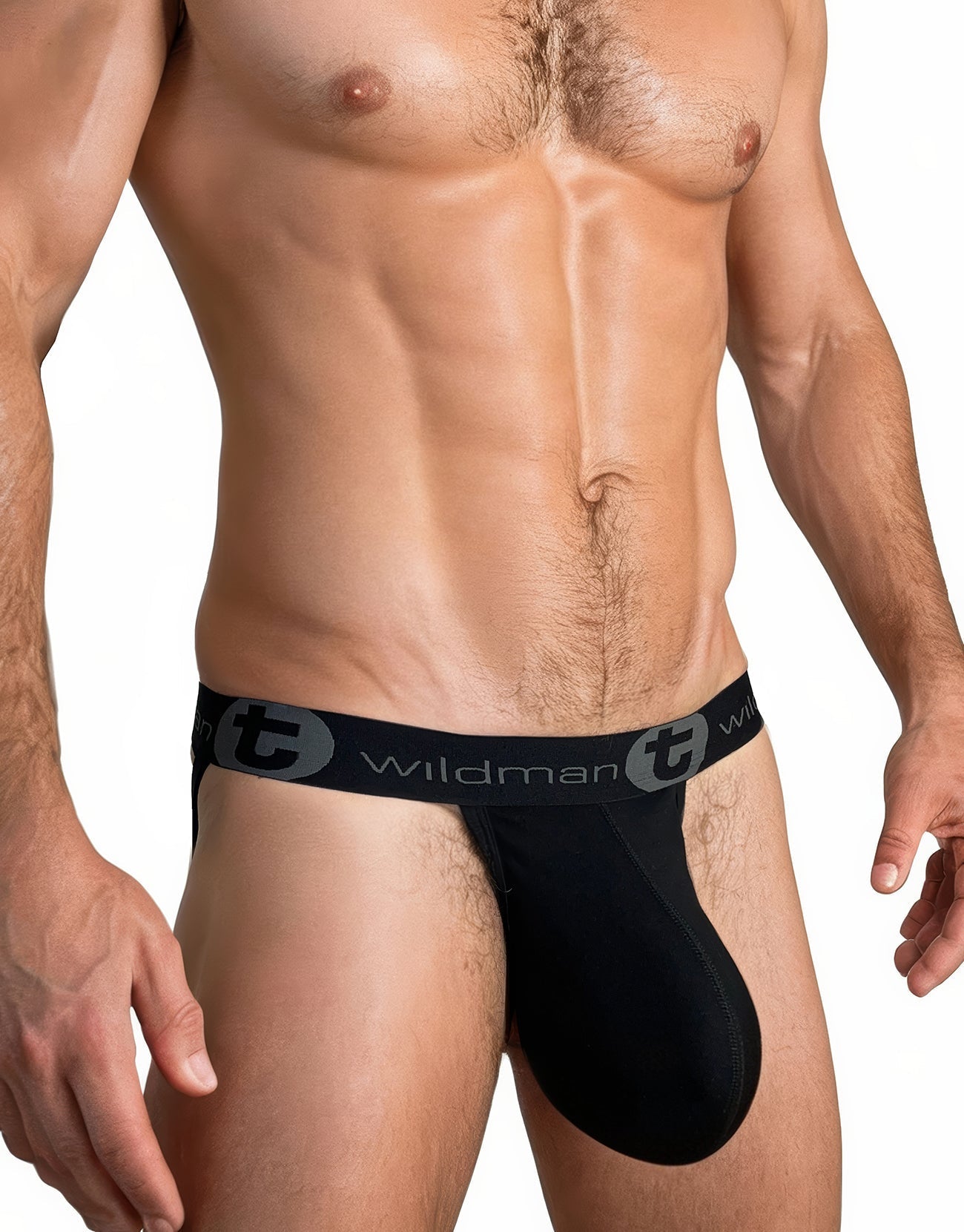 Black WildmanT jockstrap with a large contour pouch and branded elastic waistband on a muscular man.