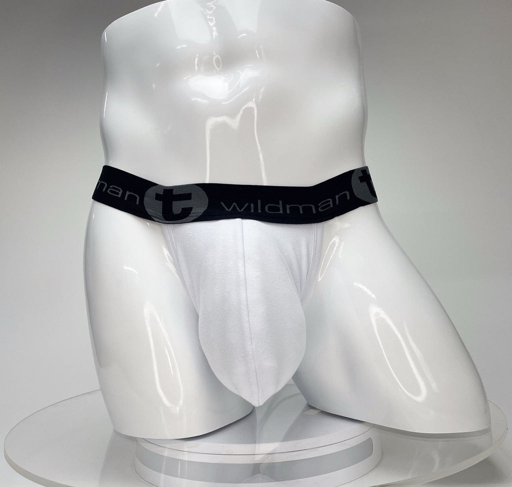 White WildmanT jockstrap with a contoured big-boy pouch and a black branded elastic waistband on a white mannequin.