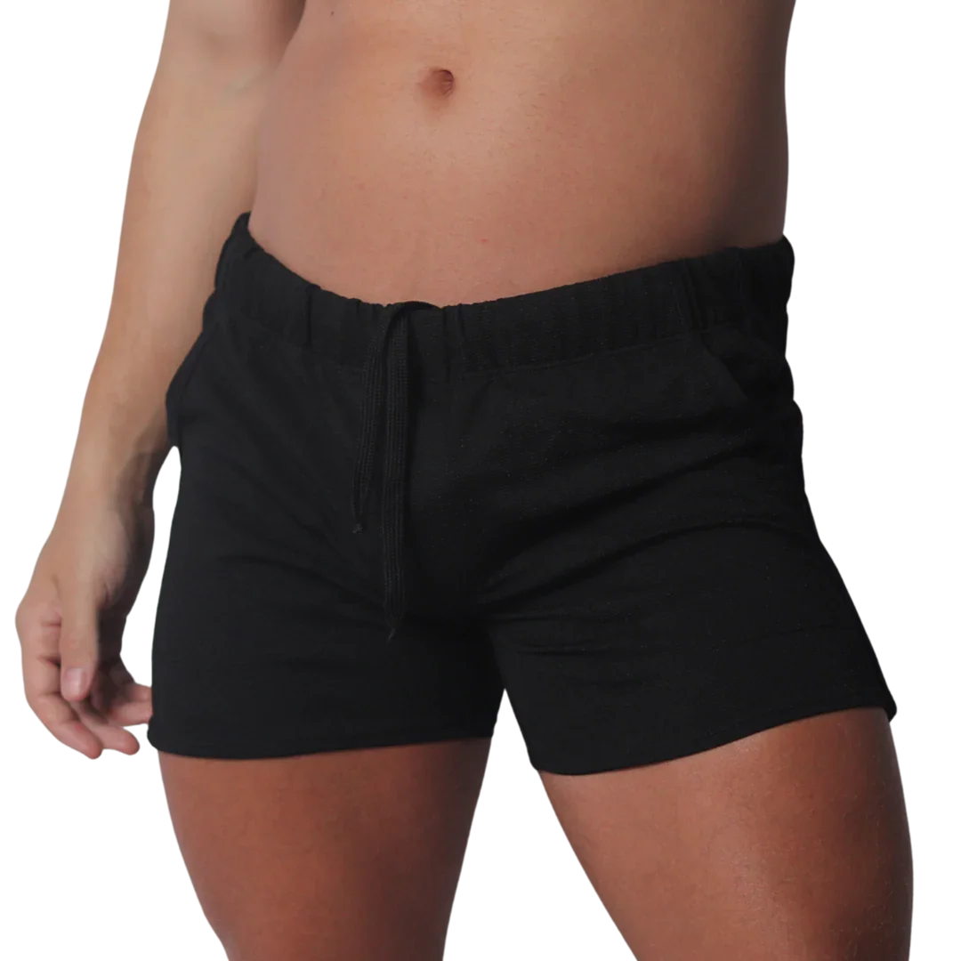 Black cotton-blend casual shorts featuring an elasticated waistband and matching drawstring.