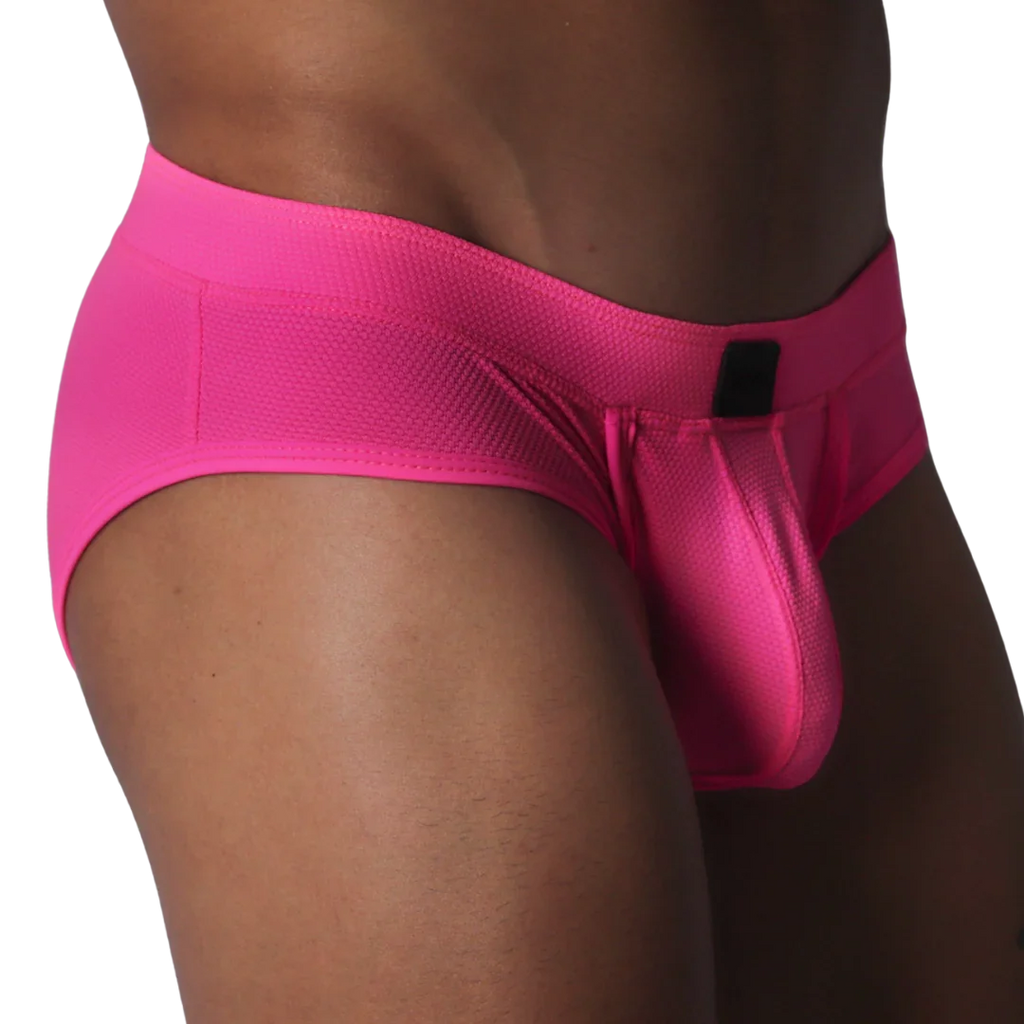 Fuchsia brief in textured, honeycomb-patterned fabric featuring a contoured pouch and a small black rectangular logo.
