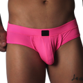 Fuchsia-colored low-rise briefs in textured mesh fabric with a centered black logo patch on the waistband.