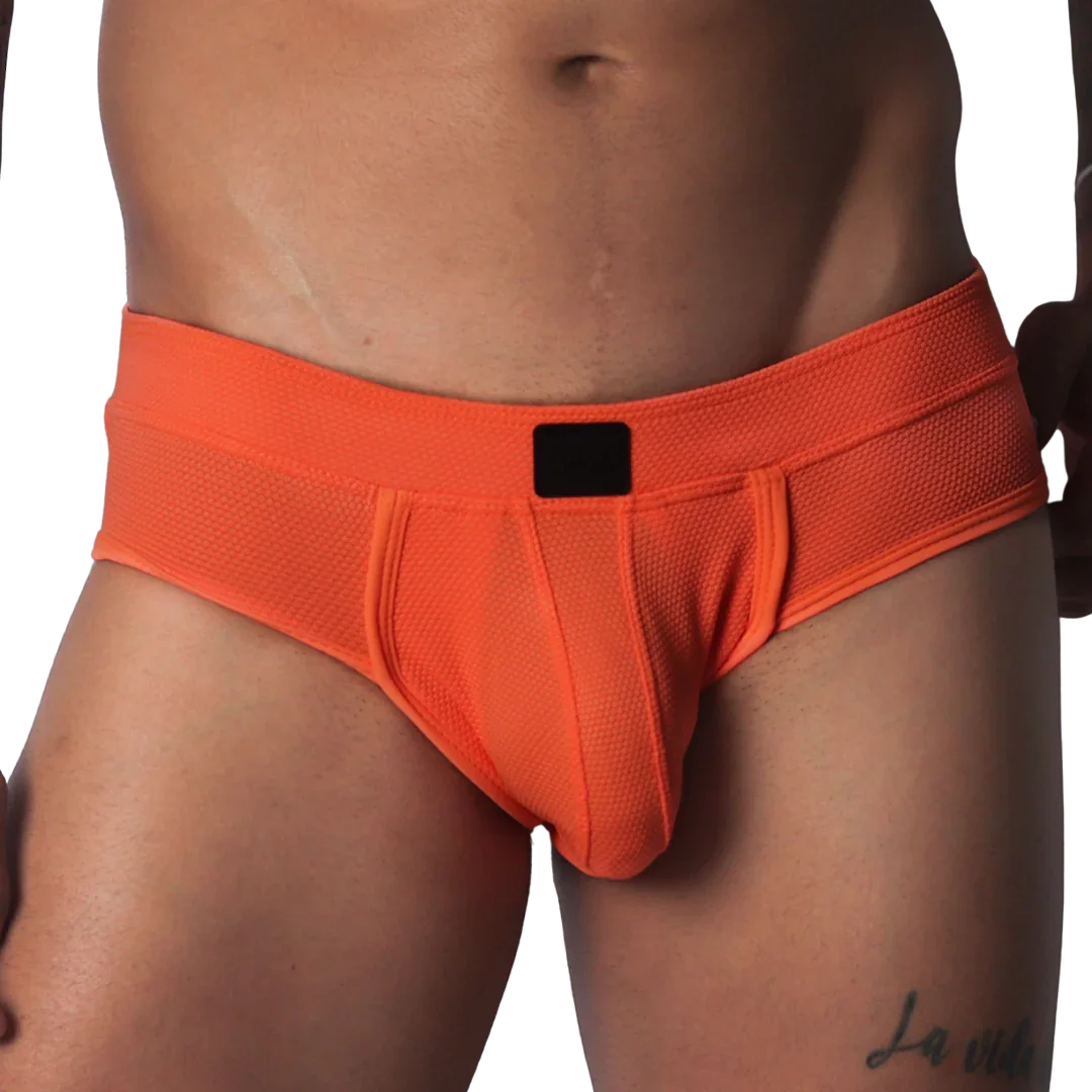 Bright orange textured micro-mesh brief with a supportive pouch and a solid black logo tag on the center waistband.