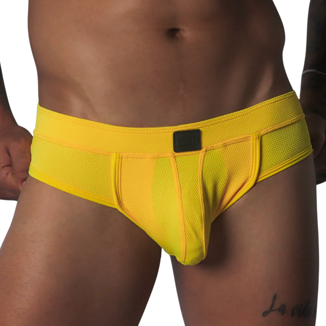 Bright yellow, textured mesh brief with a supportive pouch, tonal piping, and a small black rectangular logo patch.