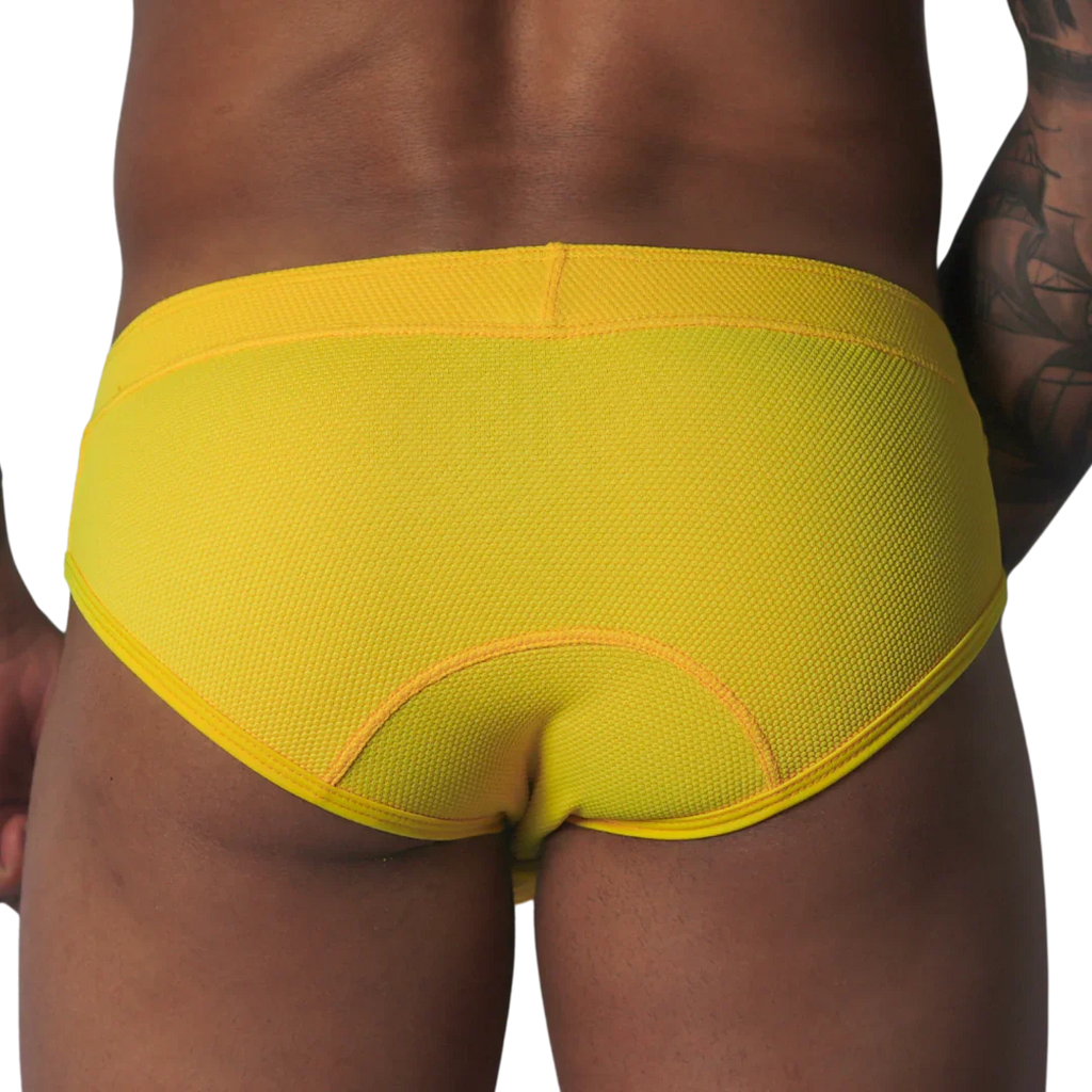 Bright yellow, textured mesh brief with curved seam detailing on the back, shown from behind.
