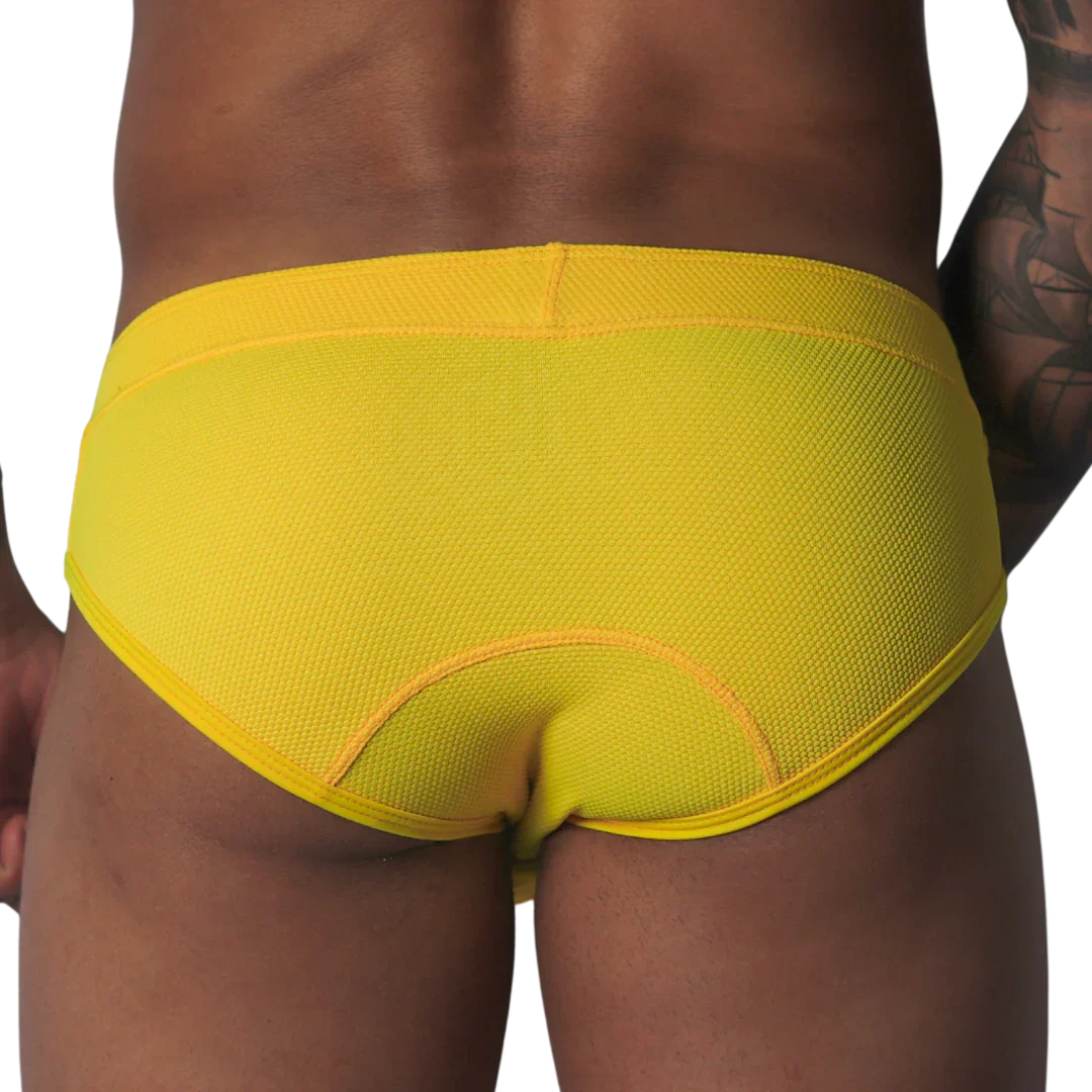 Bright yellow, textured mesh brief with curved seam detailing on the back, shown from behind.