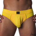 Bright yellow athletic mesh jockstrap with a wide waistband and a center black Gigo logo patch.
